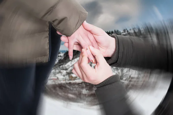 Man putting engagement ring on female hand — Stock Photo, Image