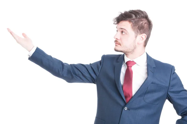 Portrait of business man showing something with his hand — Stock Photo, Image