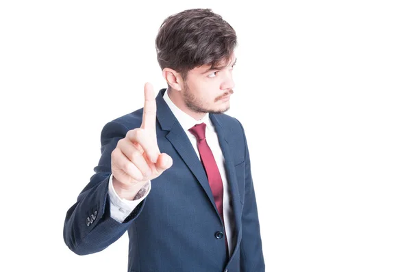Business man standing showing wait gesture — Stock Photo, Image