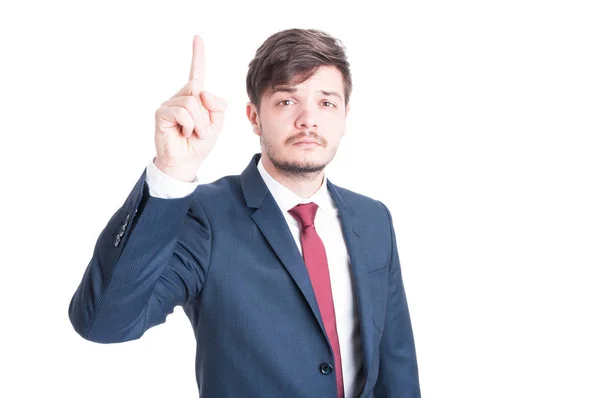 Business man standing with index finger up — Stock Photo, Image