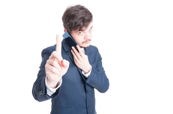 Marketing manager talking at phone showing wait a second gesture — Stock Photo, Image