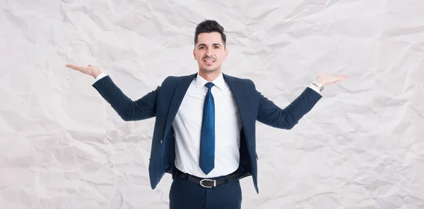 Handsome male manager with palms up — Stock Photo, Image