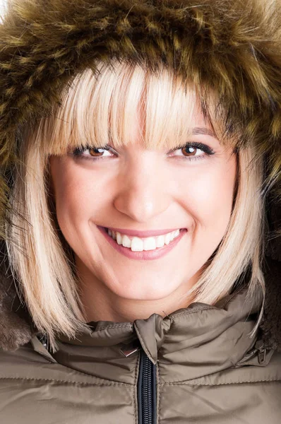 Close-up of beautiful blonde girl with fur hood on — Stock Photo, Image