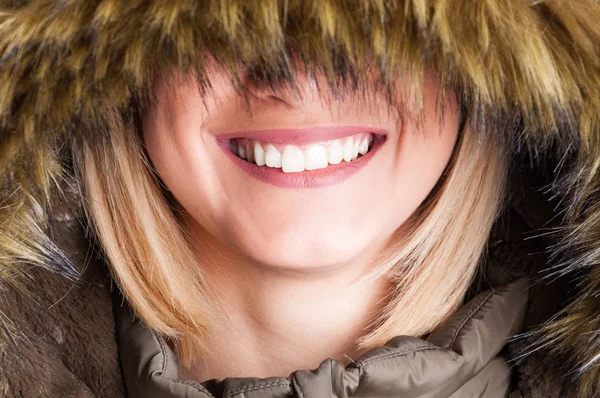 Close-up of girl with fur hood with eyes covered — Stock Photo, Image