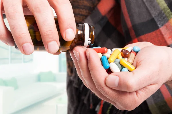 Close-up of man hand full of pills — Stock Photo, Image