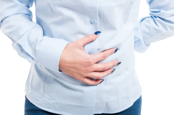 Close-up of female engineer holding her belly — Stock Photo, Image