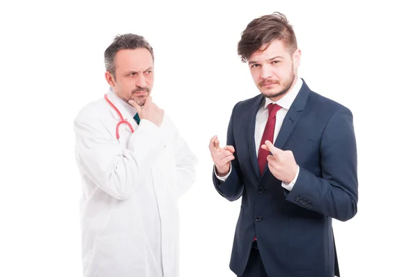 Nachdenklicher Mediziner und junger Geschäftsmann — Stockfoto
