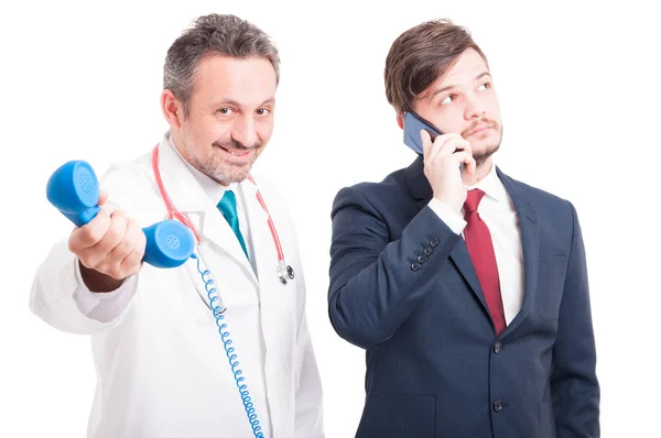 Happy doctor holding receiver — Stock Photo, Image