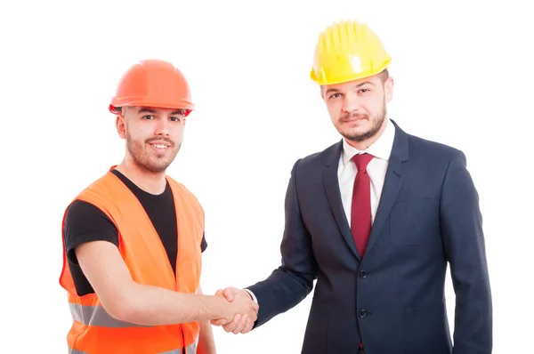 Constructor sonriente y empresario saludándose — Foto de Stock