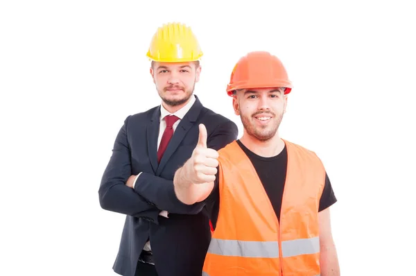 Jovem construtor mostrando-lhe os polegares para cima — Fotografia de Stock