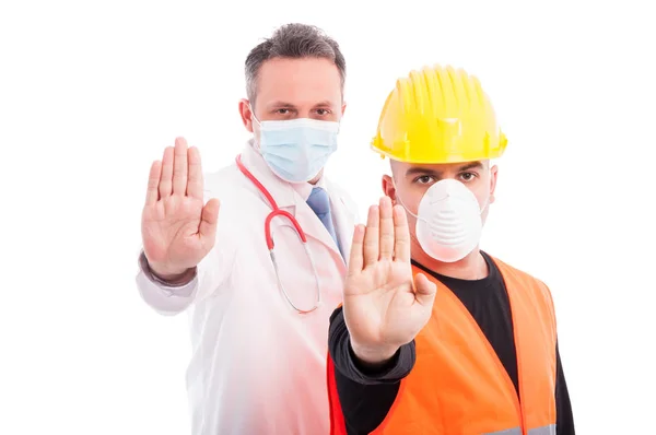 Doctor and constructor showing stop gesture with hands — Stock Photo, Image