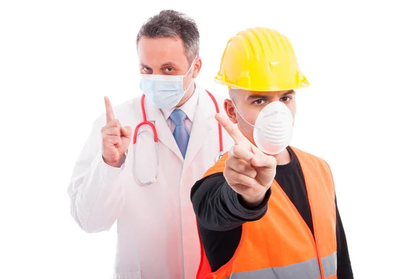 Doctor and constructor showing denial gesture — Stock Photo, Image