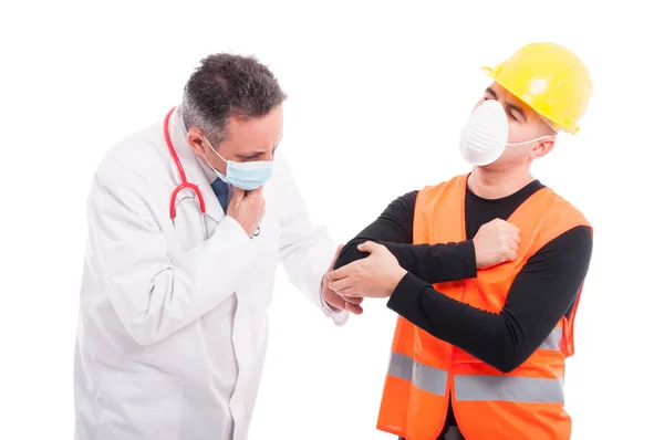 Male doctor checking constructors elbow like consultation — Stock Photo, Image