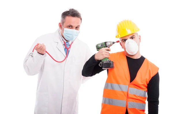 Silly doctor and constructor playing with their tools — Stock Photo, Image