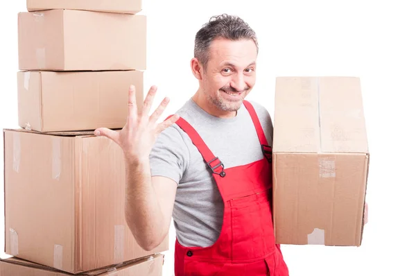 Portrait of mover man holding box showing five gesture — Stock Photo, Image