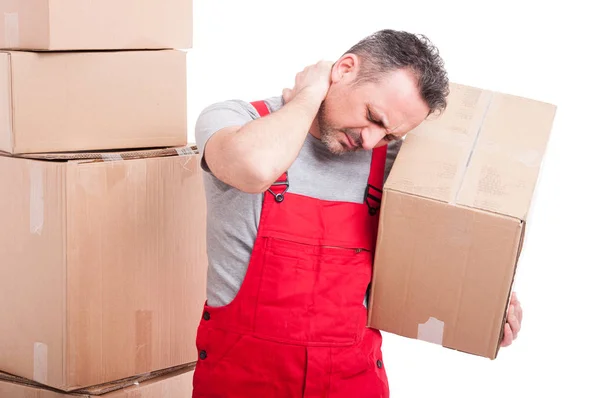 Portrait of mover holding box and having a neck pain — Stock Photo, Image