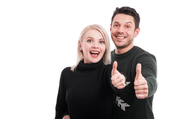 Cheerful couple showing thumbs up — Stock Photo, Image
