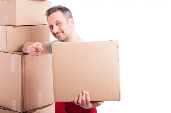 Mover guy holding and pointing a big cardboard box — Stock Photo, Image