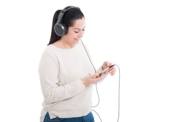Young woman listening music with headphone clipart
