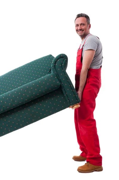Γεμάτο σώμα μετακινούμενος τύπος ανασηκώνοντας ένα βαρύ καναπέ — Φωτογραφία Αρχείου