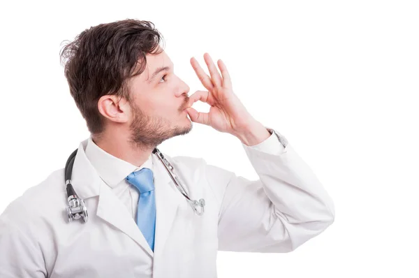 Side view of male medic kissing his fingers — Stock Photo, Image