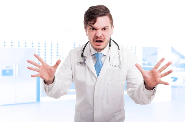 Angry young doctor showing rage and screaming — Stock Photo, Image