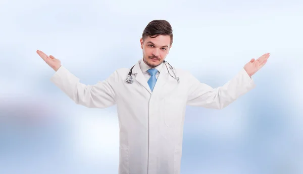 Handsome medic with palms up — Stock Photo, Image