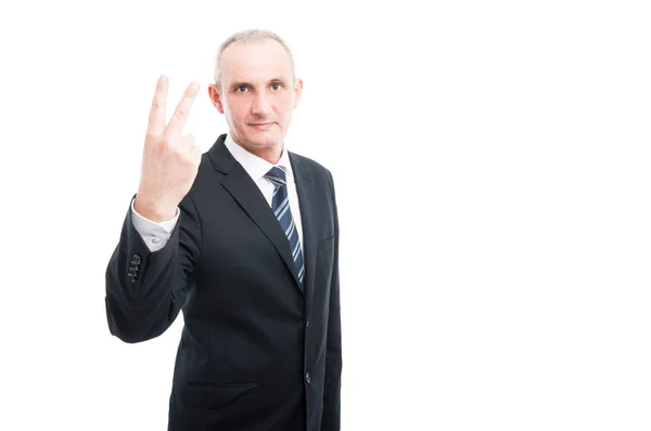 Portrait of aged elegant man showing number two gesture — Stock Photo, Image