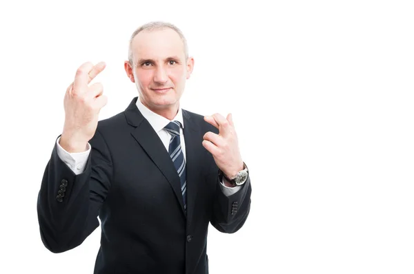 Homem elegante de meia idade fazendo dedos duplos gesto cruzado — Fotografia de Stock
