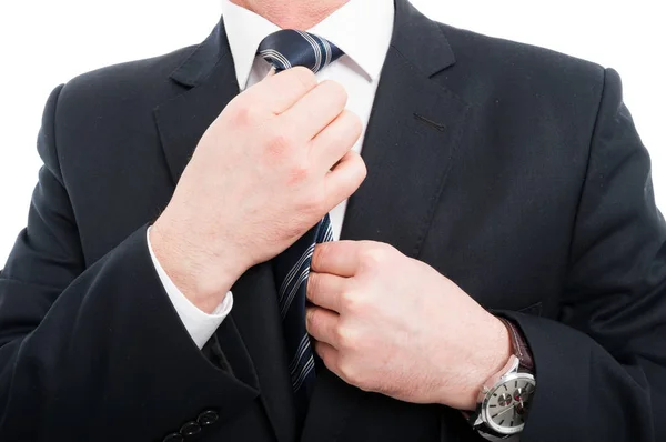Close-up of elegant man adjusting his tie wearing suit — Stock Photo, Image