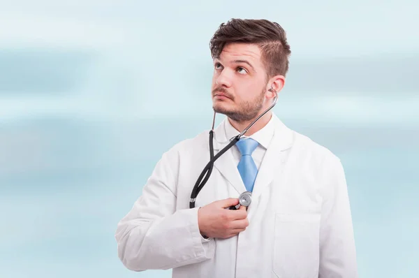 Young medic or doctor using stethoscope — Stock Photo, Image