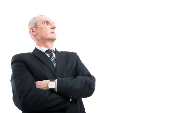 Low angle of elegant man standing with arms crossed — Stock Photo, Image