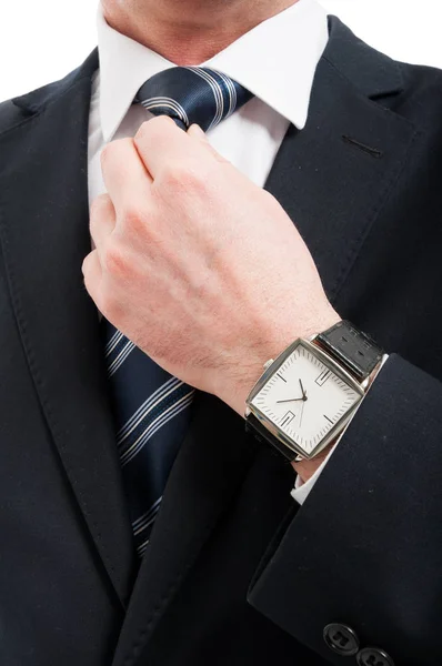 Close-up of elegant gentleman arranging his tie — Stock Photo, Image