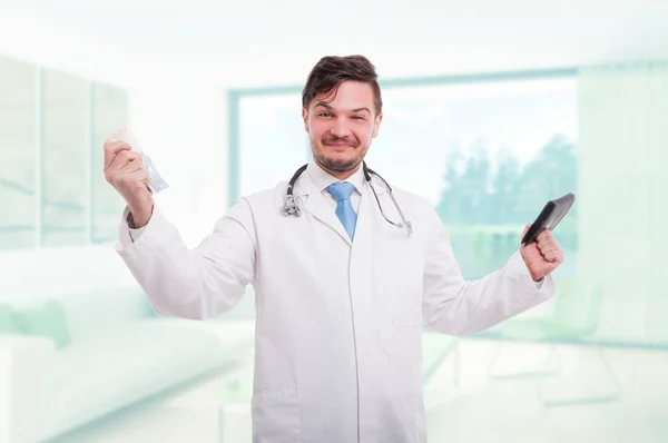 Medic acting like a winner and holding money — Stock Photo, Image