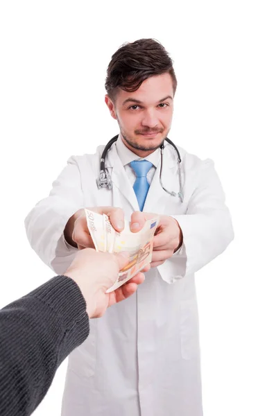 Doctor receiving money from patient