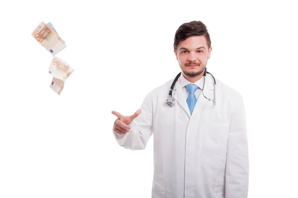 Rich male doctor drop bancknotes of euro — Stock Photo, Image