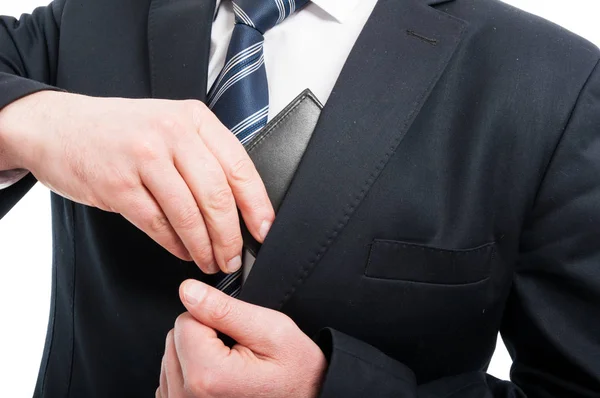 Close-up of man putting in his wallet — Stock Photo, Image