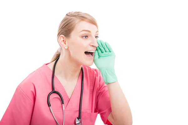 Female medical nurse wearing scrubs yelling out loud — Stock Photo, Image