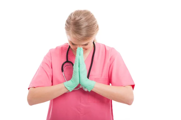 Enfermeira loira orando por algo — Fotografia de Stock