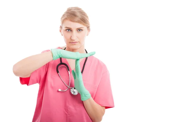 Female medical nurse making time out gesture Royalty Free Stock Images