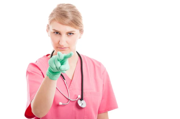 Female medical nurse showing watching you gesture Royalty Free Stock Photos
