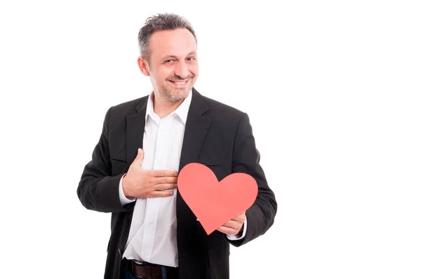 Joyful young man holding paper heart — Stock Photo, Image