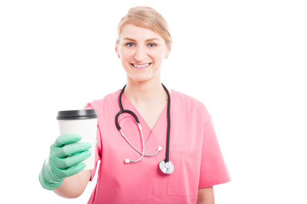 Friendly medical nurse lady smiling holding coffee cup