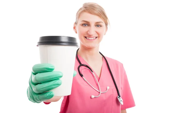 Selective focus of nurse lady showing coffee cup — Stock Photo, Image