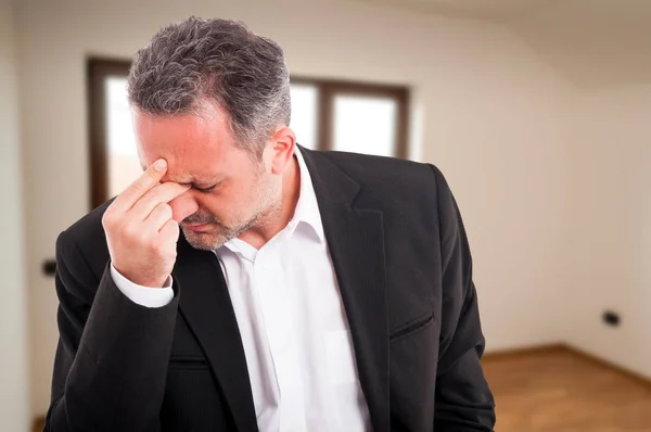 Sad young realtor with migraine — Stock Photo, Image