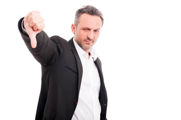 Handsome man showing thumbs down sign — Stock Photo, Image