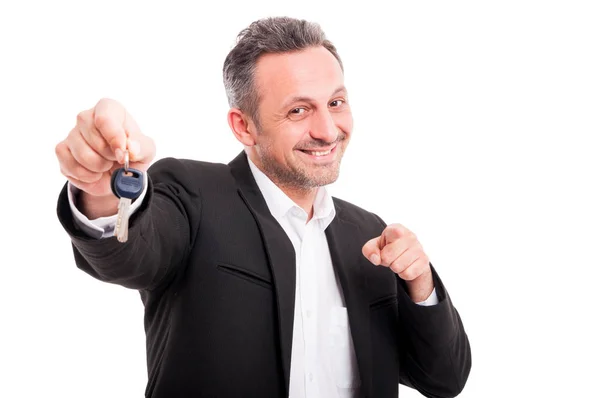 Businessman with key of real estate in hand — Stock Photo, Image