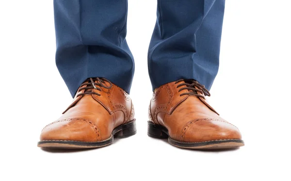 Feet of man with brown shoes in close-up — Stock Photo, Image