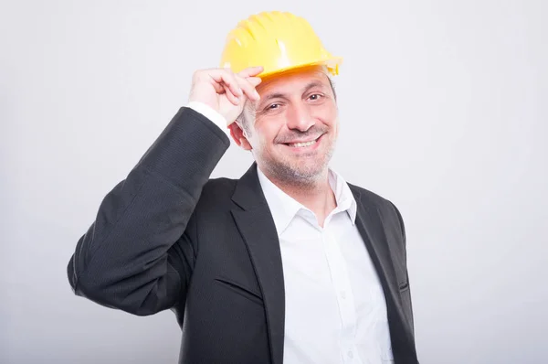 Portrait of foreman smiling holding his hardhat — Stock Photo, Image