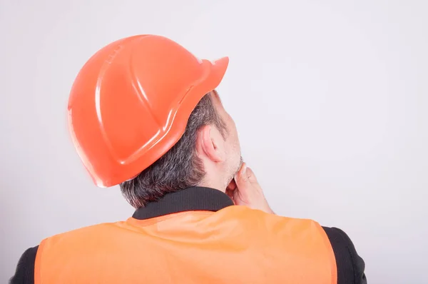 Back view of engineer making thinking gesture — Stock Photo, Image